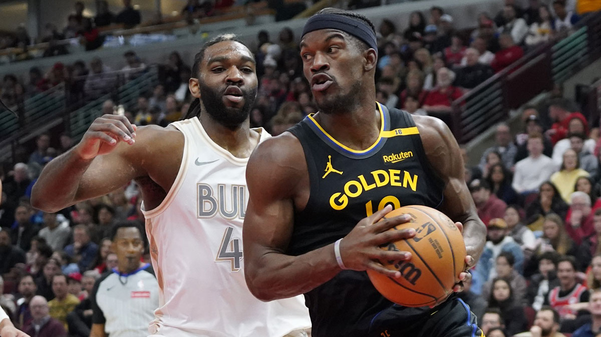 Chicago Bulls Next Patrick Williams (44) Defend Gold State Warriors forward Jimmy Butler (10) during the first half in the United Center.