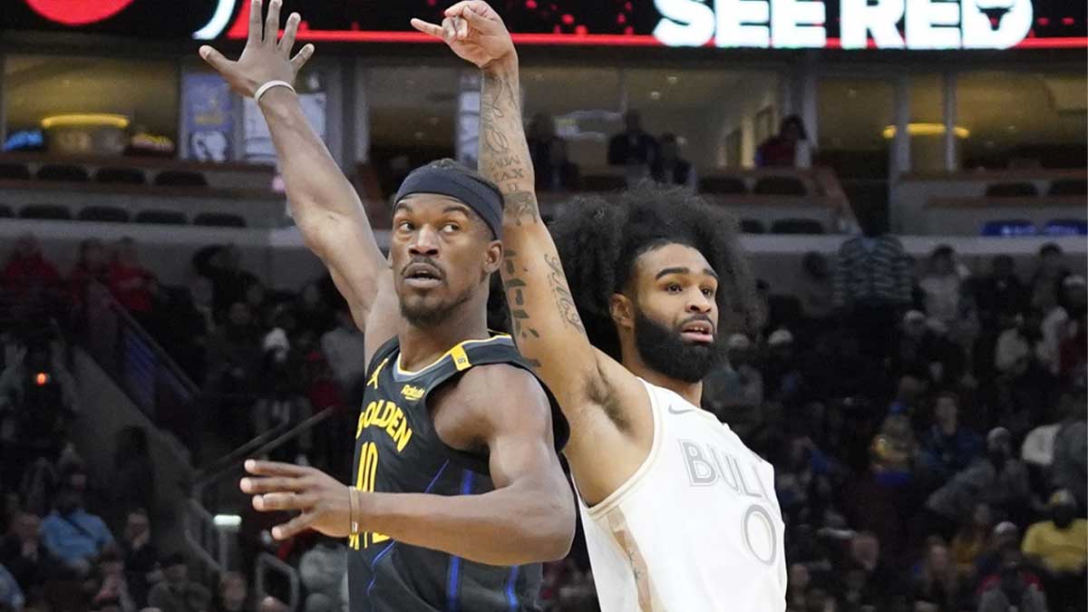 8. February 2025; Chicago, Illinois, USA; Gold State Warriors Next Jimmy Butler (10) Brane Chicago Bulls Guard Cobi White (0) During the second half in the United Center. Mandatory Credit: David Banks-IMSN Pictures