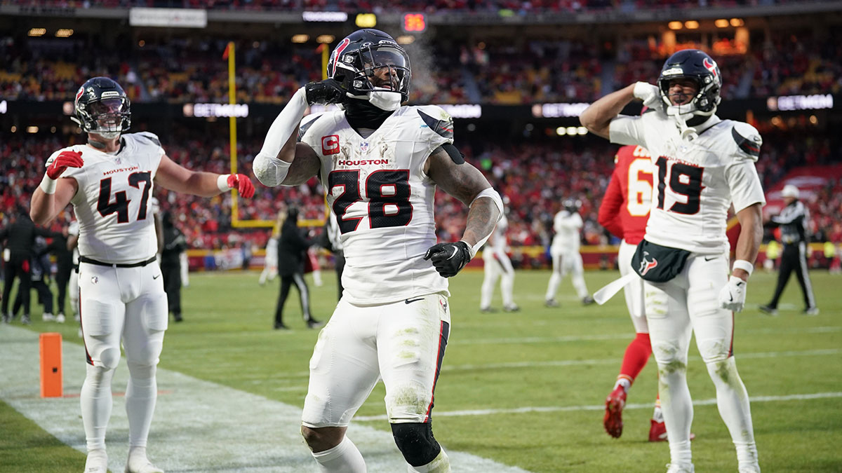 Jan 18, 2025; Kansas City, Missouri, USA; Houston Texans running back Joe Mixon (28) celebrates with fullback Andrew Beck (47) and wide receiver Xavier Hutchinson (19) after scoring a touchdown against the Kansas City Chiefs during the third quarter of a 2025 AFC divisional round game at GEHA Field at Arrowhead Stadium. 