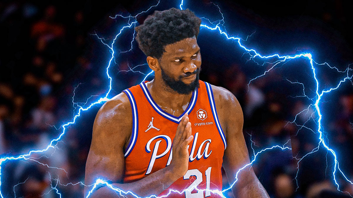 76ers star Joel Embiid with waves of electricity around him, Wells Fargo Center in back