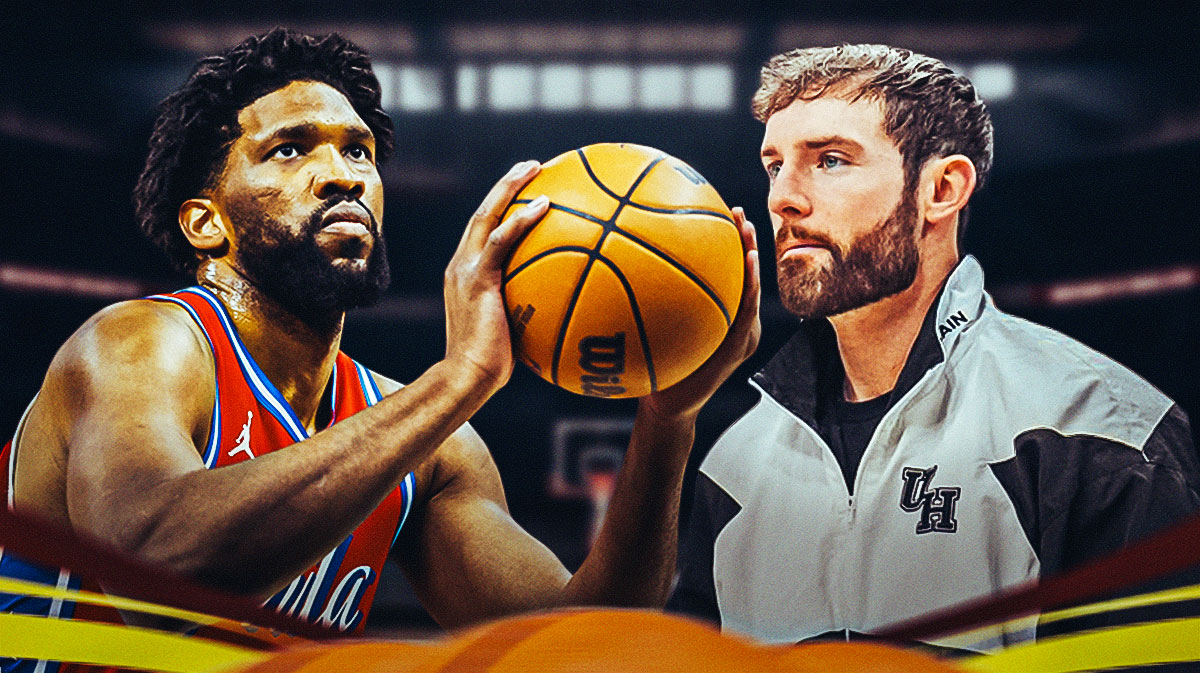 Philadelphia 76ers center Joel Embiid shooting a ball, and his trainer, Drew Hanlen standing next to him, with the 76ers home arena in the background.