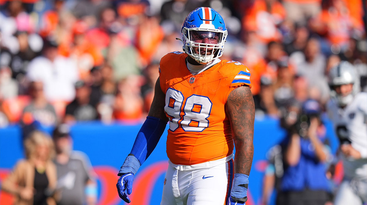 Denver Broncos defensive end John Franklin-Myers (98) reacts to a defensive stop in the second half against the Las Vegas Raiders at Empower Field at Mile High.