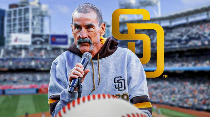 John Seidler next to Padres logo