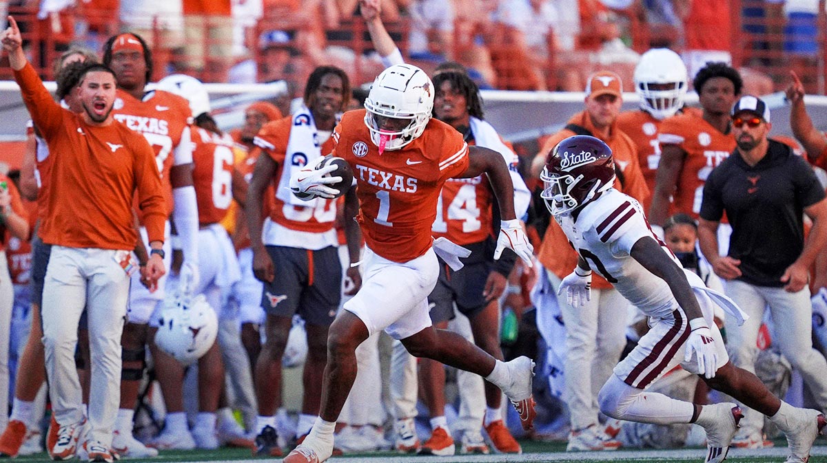 Texas Longhorns wide receiver Johntay Cook II (1) runs from Mississippi State Bulldogs safety Corey Ellington (10) in the second half at Darrell K Royal-Texas Memorial Stadium.