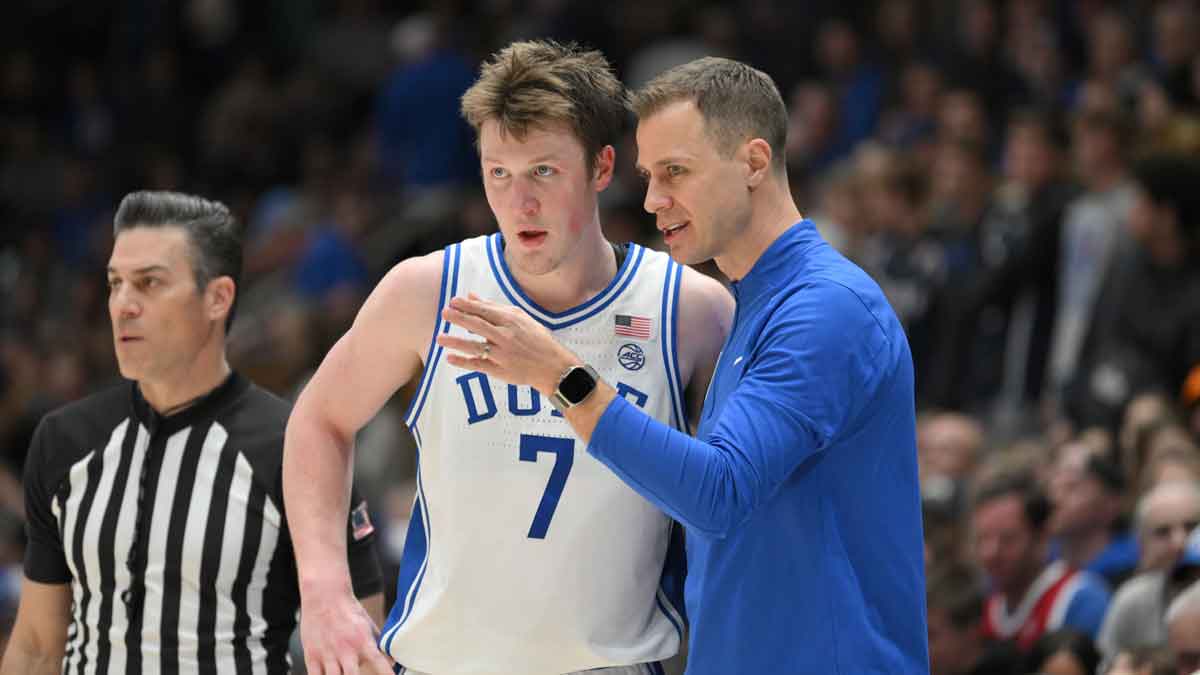 Duke Blue Devils head coach Jon Scheyer directs Duke Blue Devils forward Kon Knueppel (7) during the second half at Cameron Indoor Stadium.