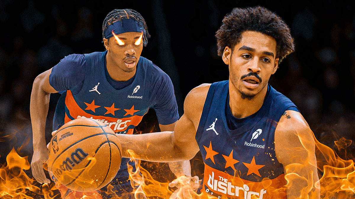 Jordan Poole smiles at Bilal Coulibaly. Coulibaly with fire in his eyes