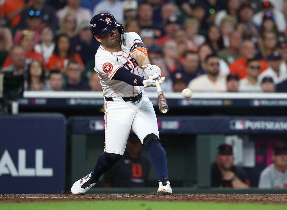 Houston Astros second base Jose Altuve (27) hits a single in the third inning against the Detroit Tigers in game one of the Wild Card round for the 2024 MLB Playoffs at Minute Maid Park.