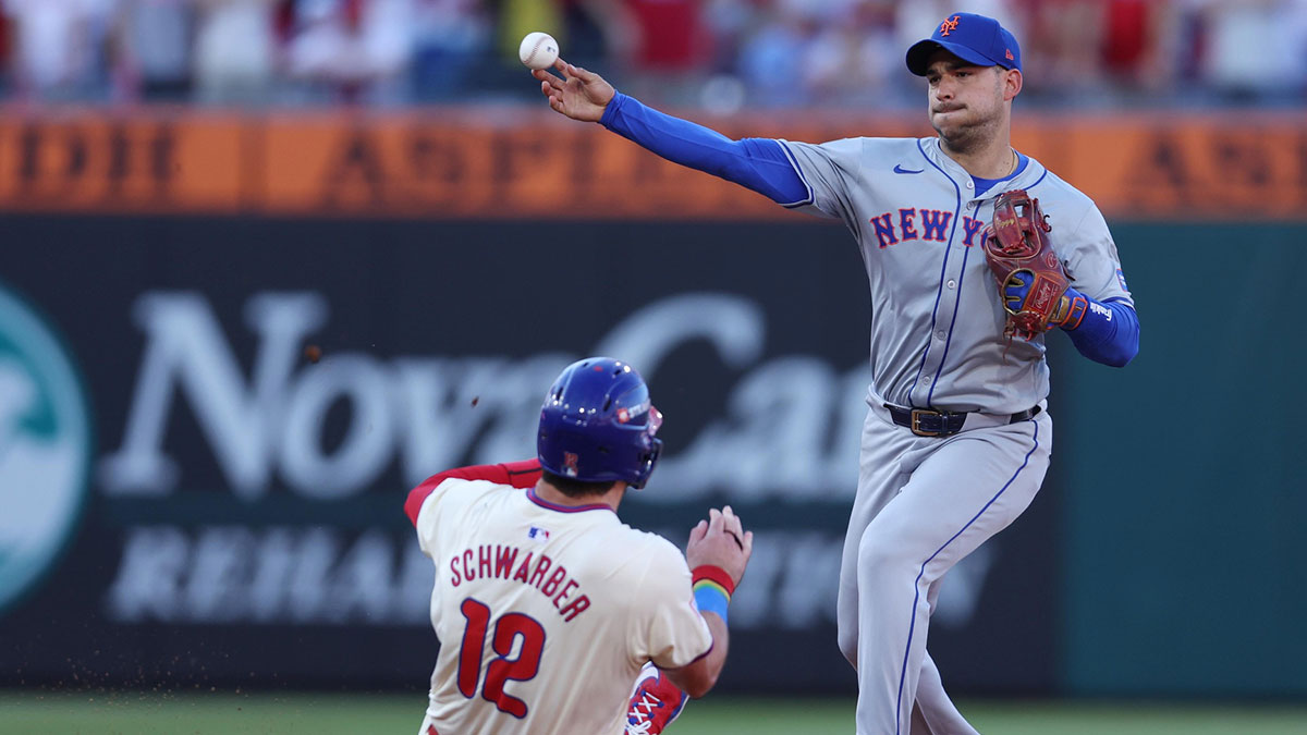 New York Mets second baseman Jose Iglesias (11) forces out Philadelphia Phillies designated hitter Kyle Schwarber (12) in the third inning in game one of the NLDS for the 2024 MLB Playoffs at Citizens Bank Park.