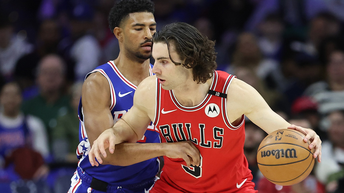 Chicago Bulls guard Josh Giddey (3) controls the ball against Philadelphia 76ers guard Quentin Grimes (5) during the first quarter at Wells Fargo Center.