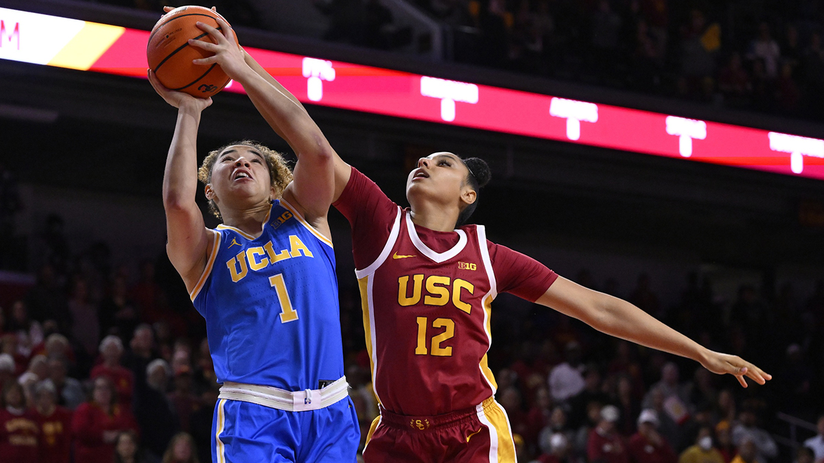 UCLA Burins Guard Kiki Rine (1) Drive to the basket against USC trojans preserve Jujatins (12) during the first quarter in Galen Centur.