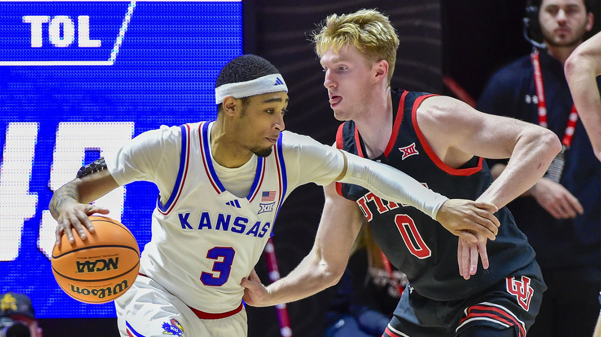 Utah Utes guard Hunter Erickson (0) defends Kansas Jayhawks guard Dajuan Harris Jr. (3) during the second half at the Jon M. Huntsman Center.