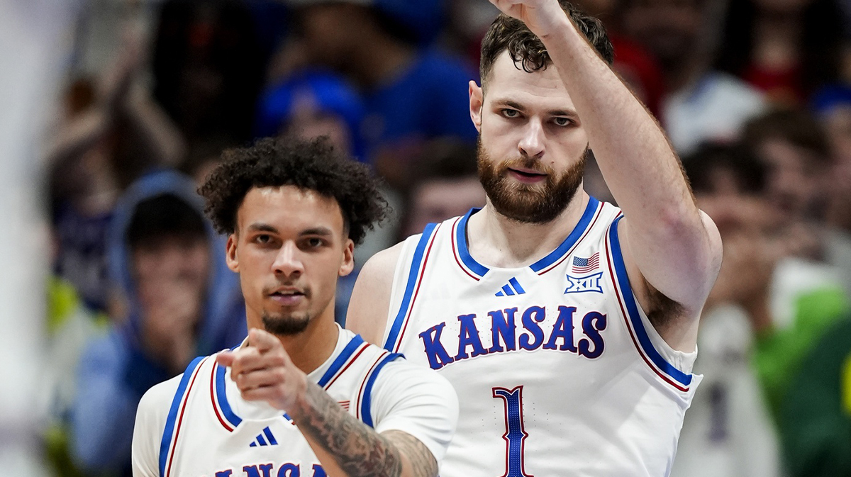 Kansas Jayhawks guard Zeke Mayo (5) and center Hunter Dickinson (1) react during the first half against the Iowa State Cyclones at Allen Fieldhouse.