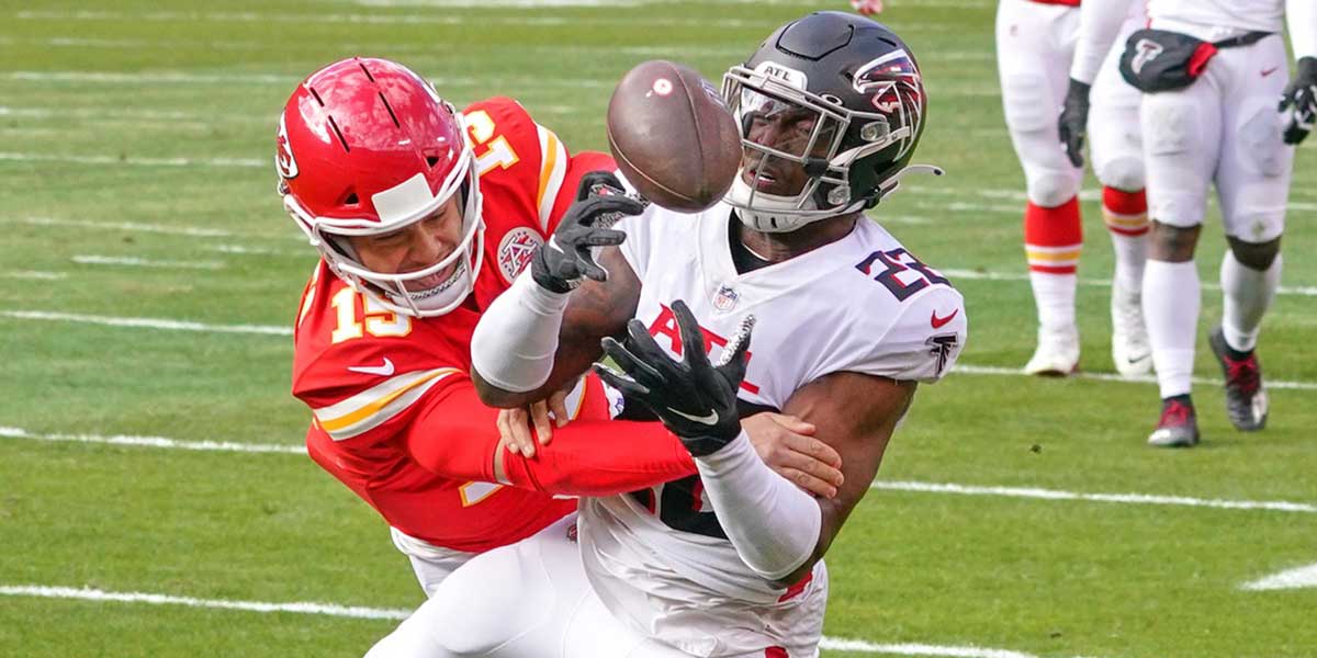 Atlanta Falcons strong safety Keanu Neal (22) intercepts a pass intended for Kansas City Chiefs quarterback Patrick Mahomes (15) during the game at Arrowhead Stadium