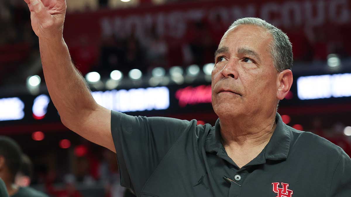 Houston Cougars head coach Kelvin Sampson sings the school song after defeating the Iowa State Cyclones in the second half at Fertitta Center.