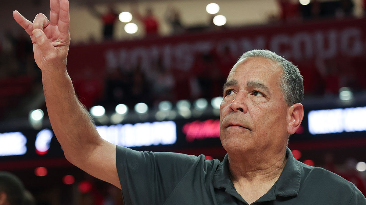 Houston Cougars head coach Kelvin Sampson sings the school song after defeating the Iowa State Cyclones in the second half at Fertitta Center.