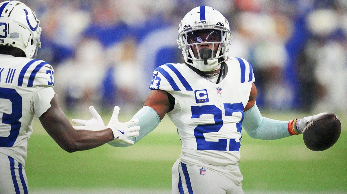 Indianapolis Colts cornerback Kenny Moore II (23) high fives Indianapolis Colts cornerback Samuel Womack III (33) after making an interception at the end of the game during a game against the Tennessee Titans at Lucas Oil Stadium.