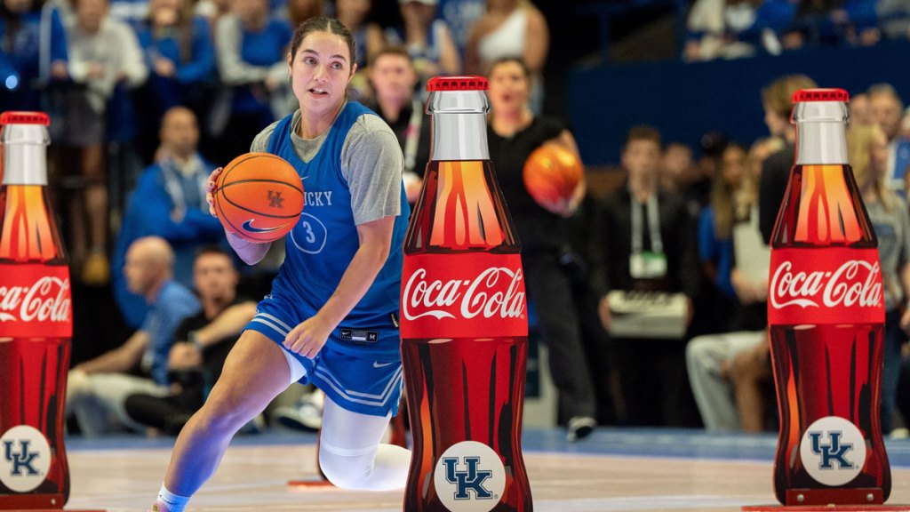 Kentucky women's basketball guard Georgia Amoore (3) weaves between obstacles during Big Blue Madness.