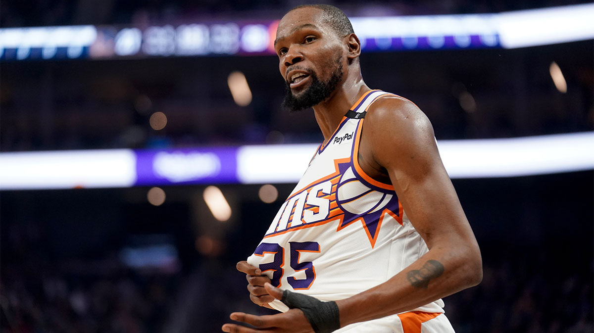 Phoenix Suns forward, Kevin Durant (35) reacts after his jersey pulled during the action against golden state warriors in the first quarter in Chese Center.