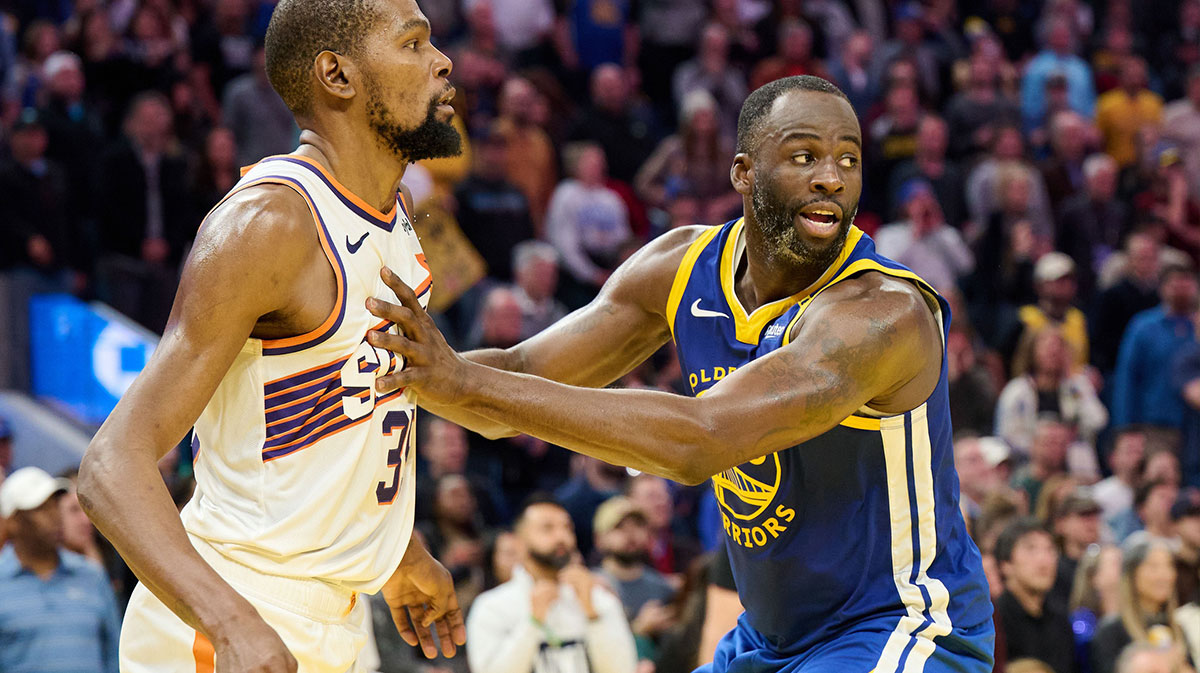 Golden State Warriors forward Draymond Green (23) defends against Phoenix Suns forward Kevin Durant (35) during the fourth quarter at Chase Center.