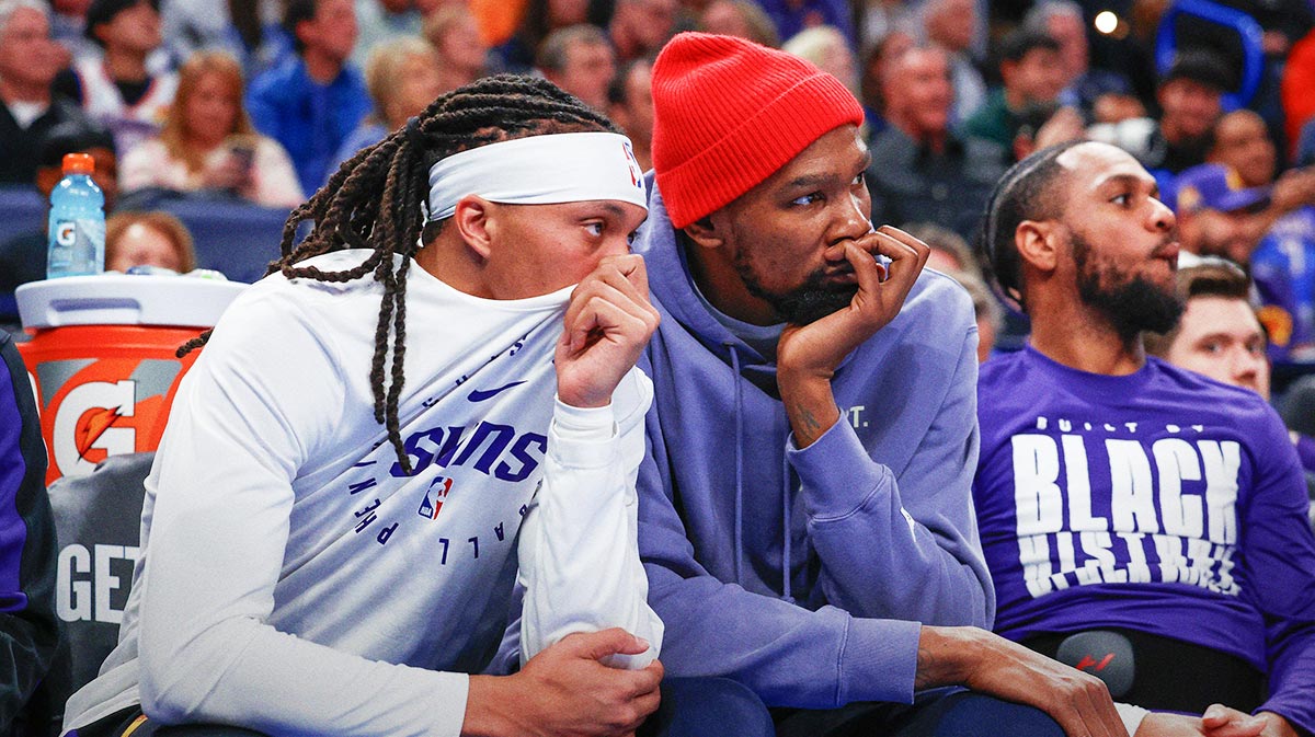 Phoenix Suns guard Damion Lee (10) and Phoenix Suns forward Kevin Durant (35) watch their team play against the Oklahoma City Thunder during the second half of a game at Paycom Center. 