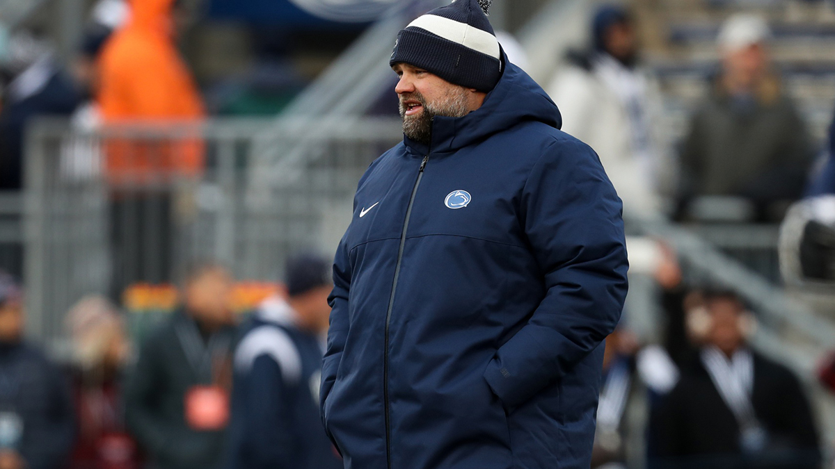 Nov 30, 2024; University Park, Pennsylvania, USA; Penn State Nittany Lions offensive coordinator Andy Kotelnicki walks on the field during warm ups before a game against the Maryland Terrapins at Beaver Stadium. Mandatory Credit: Matthew O'Haren-Imagn Images