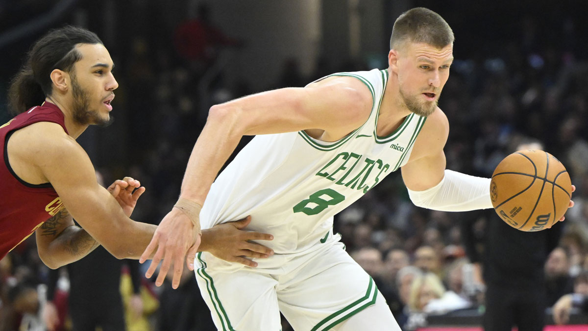 Cleveland Cavaliers forward Jaylon Tyson(24) defends Boston Celtics center Kristaps Porzingis (8) in the second quarter at Rocket Mortgage FieldHouse.