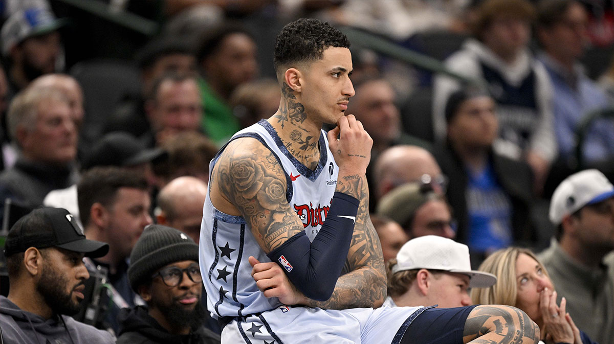 Washington Wizard's front Kyle Kuzma (33) looks at the side before entering the game against Dallas Mavericks during the second quarter in the center of American Airlines. 