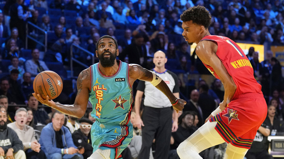 Shaq’s OGs guard Kyrie Irving (11) of the Dallas Mavericks controls the ball against Chuck’s Global Stars forward Victor Wembanyama (1) of the San Antonio Spurs during the 2025 NBA All Star Game at Chase Center.