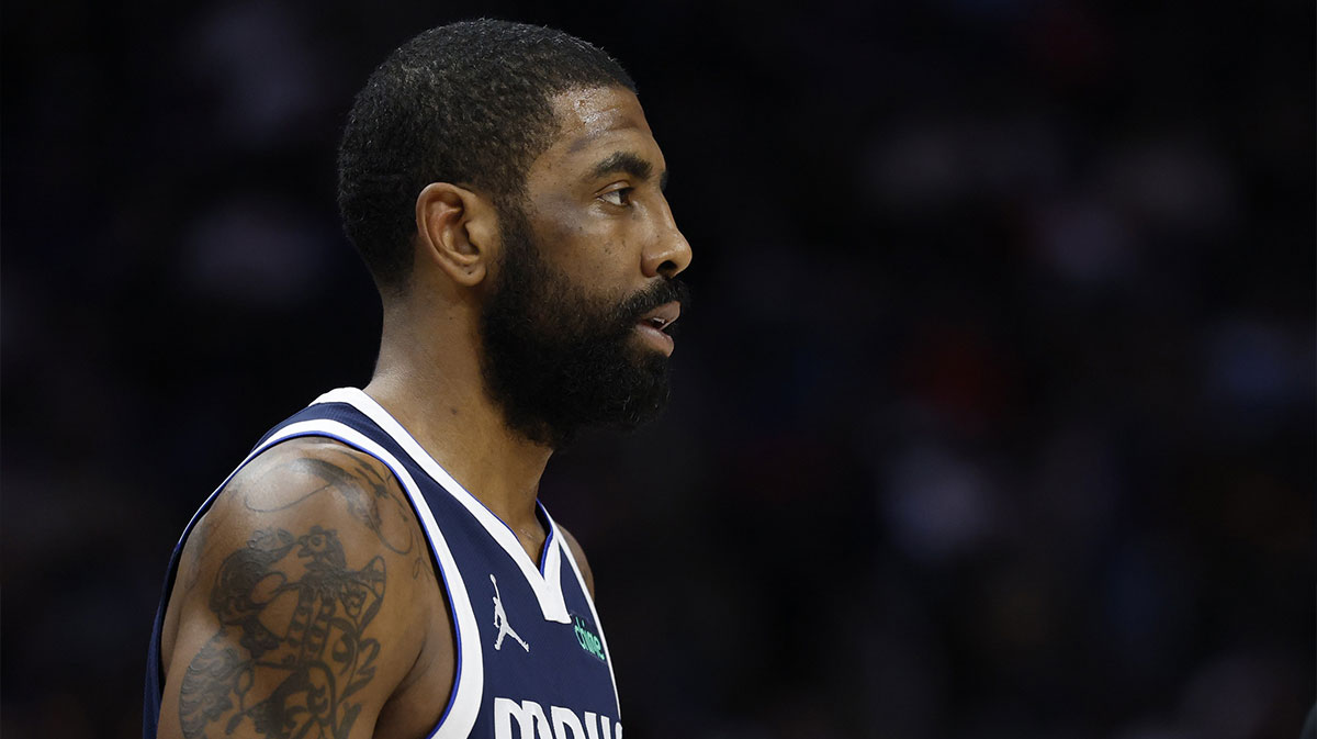 Dallas Mavericks guard Kyrie Irving (11) looks on in the first half against the Detroit Pistons at Little Caesars Arena.