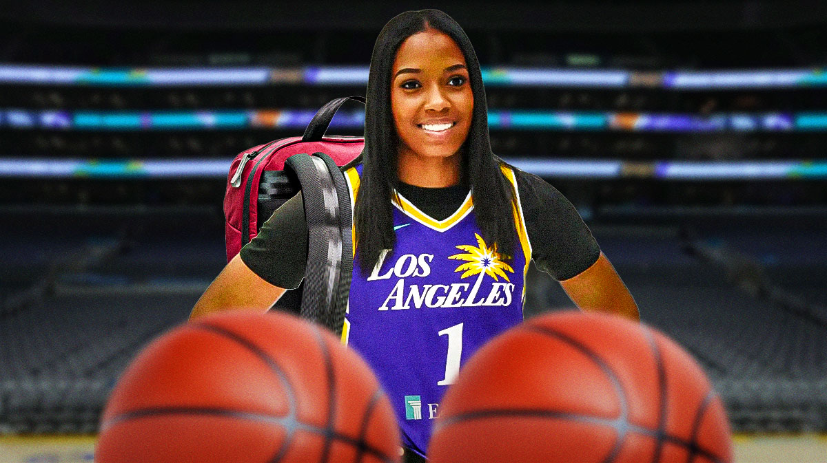 Sparks guard Zia Cooke with a backpack on, and her back turned towards the Sparks home arena