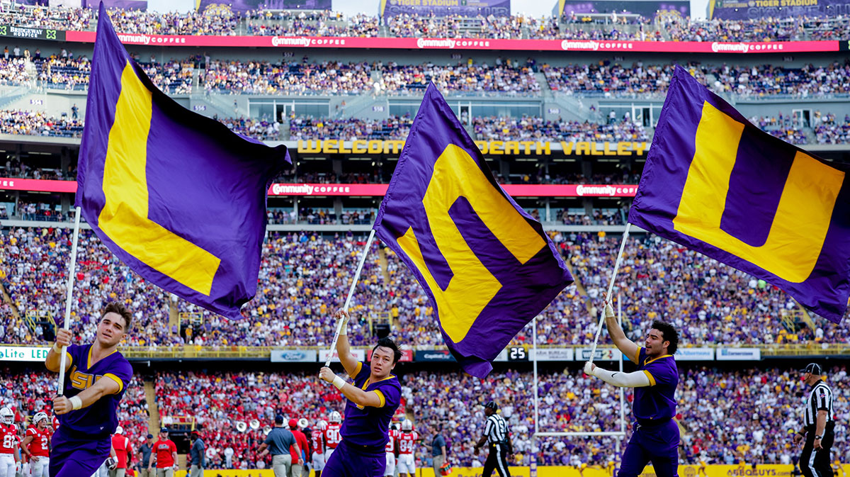 LSU Tigers cheerleaders wave flags after a touchdown against the Mississippi Rebels during the second half at Tiger Stadium.