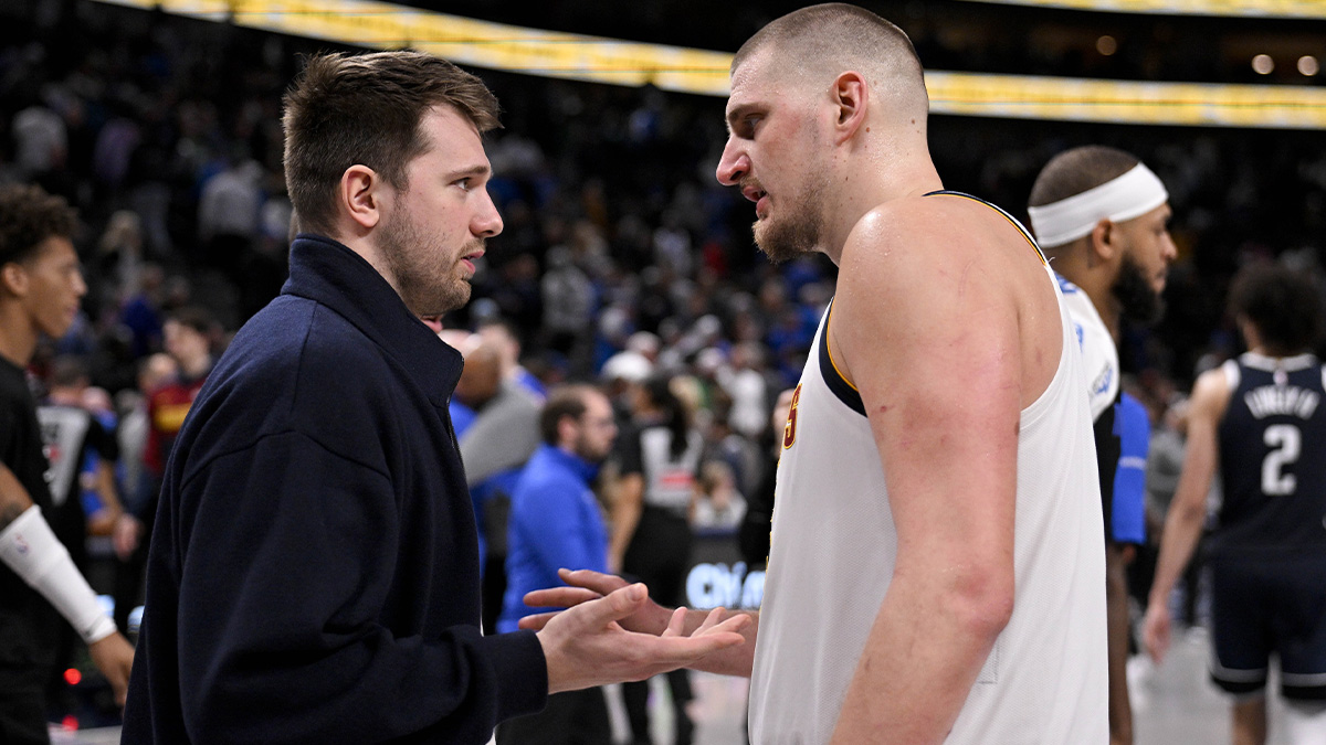 Dallas Mavericks guard Luka Doncic (left) talks with Denver Nuggets center Nikola Jokic (right) after the game at the American Airlines Center.