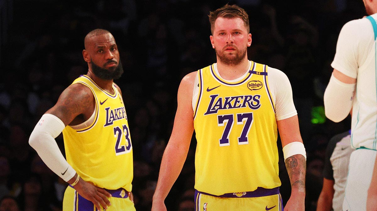 Los Angeles Lakers forward LeBron James (23) and guard Luka Doncic (77) during the second quarter against the Charlotte Hornets at Crypto.com Arena.