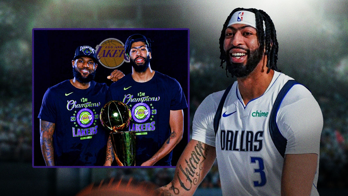 Mavericks' Anthony Davis smiling at pic of him and Lakers' LeBron James holding the 2020 NBA championship together