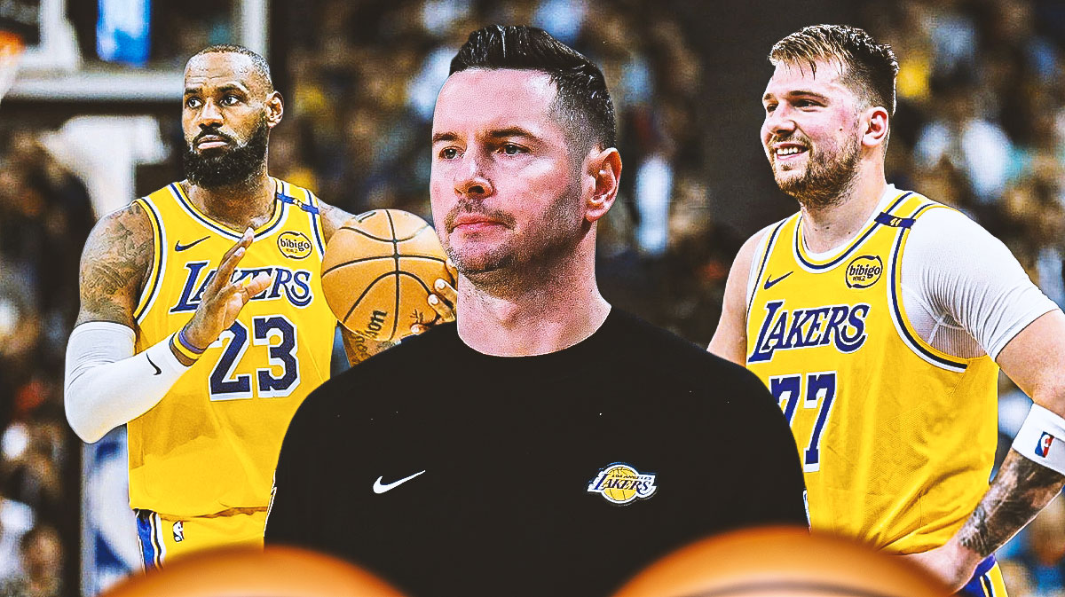 Los Angeles Lakers head coach JJ Redick in the center with LeBron James and Luka Doncic on either side in front of Crypto.com Arena.