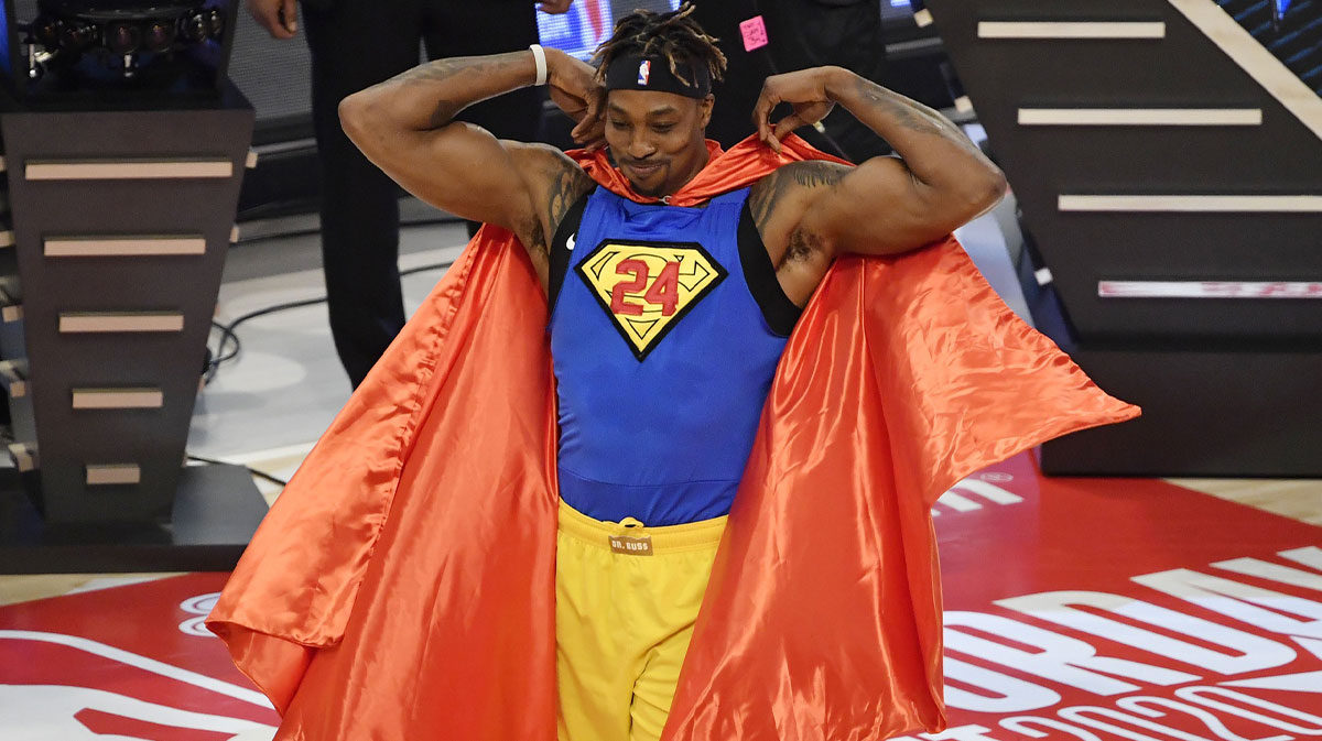 Lakers player Dwight Howard puts on a Superman costume in the slam dunk contest
