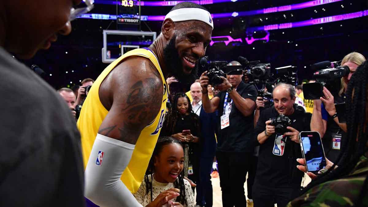 Los Angeles Lakers forward LeBron James (6) celebrates with his daughter Zhuri James after breaking the all-time scoring record in the third quarter against the Oklahoma City Thunder at Crypto.com Arena.