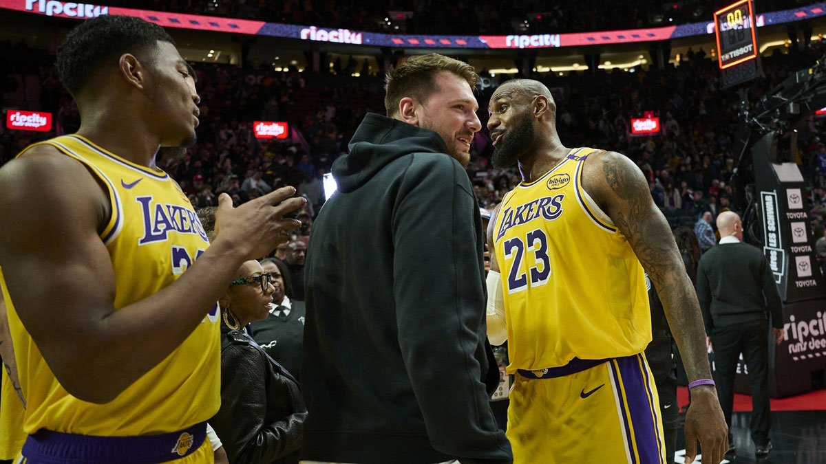  Lakers forward LeBron James (23) celebrates with guard Luka Doncic (77) and forward Rui Hachimura (28) after beating the Portland Trail Blazers at Moda Center