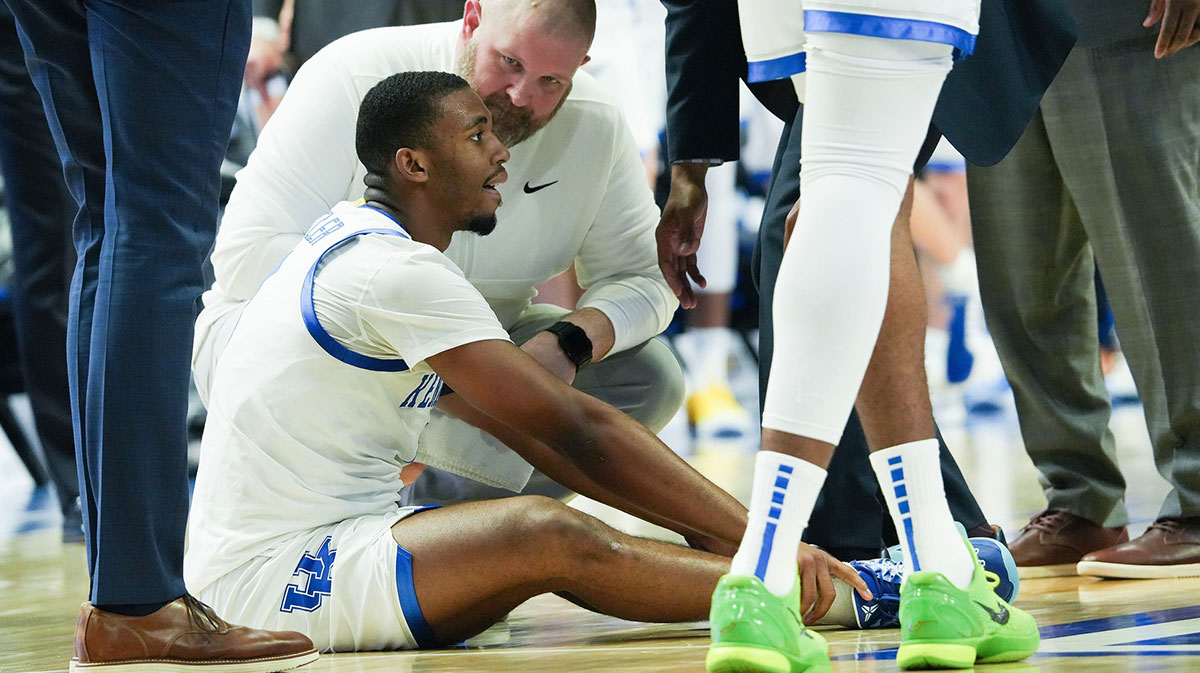 The Kentucky staff checked on Lamont Butler (1) after he was injured against Tennessee during their game at Rupp Arena in Lexington, Ky. on Feb. 11, 2025.