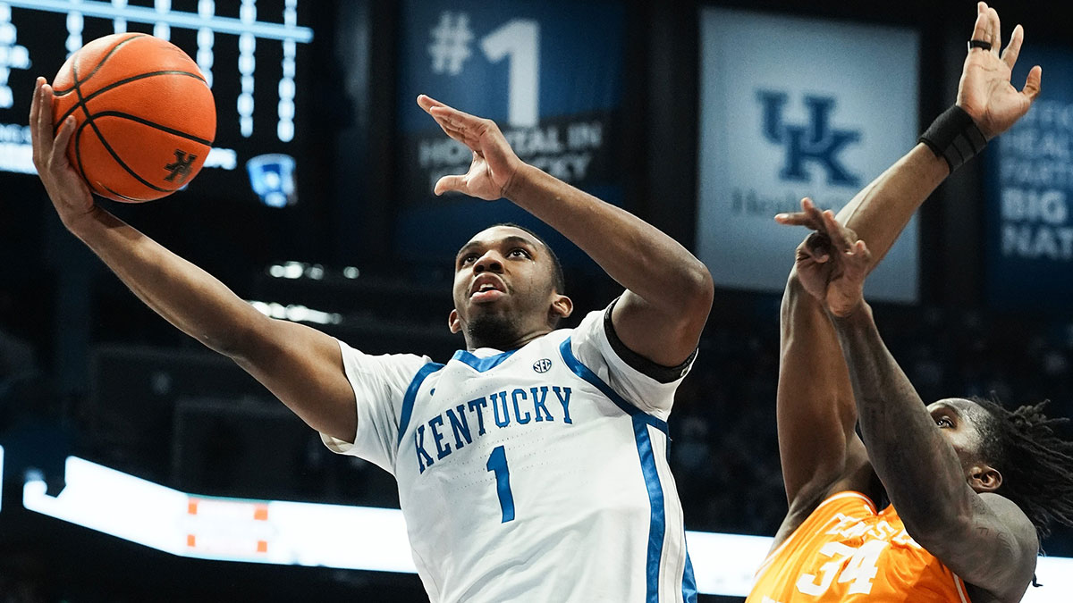 Kentucky's Lamont Butler (1) scores against Tennessee's Felix Okpara (34) during their game at Rupp Arena in Lexington, Ky. on Feb. 11, 2025.