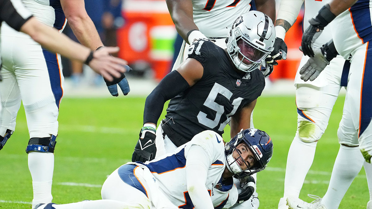 Denver Broncos quarterback Jarrett Stidham (4) reacts after being knocked down by Las Vegas Raiders defensive end Malcolm Koonce (51) during the second quarter at Allegiant Stadium.