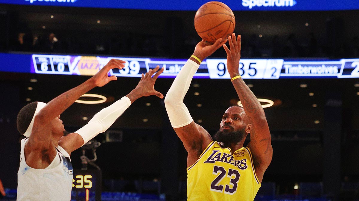 Los Angeles Lakers forward LeBron James (23) shoots against Minnesota Timberwolves guard Nickeil Alexander-Walker (9) during the second quarter at Crypto.com Arena.