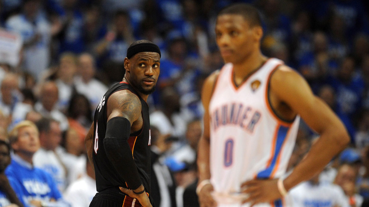 Miami heat Mali award Lebron James (6) Looks over the shoulder during the game next to Oklahoma City Thunder Point Guars Russell Westbrook in 2012 NBA Finals in the NBA 2012 in Chesapeake Energy Arena.