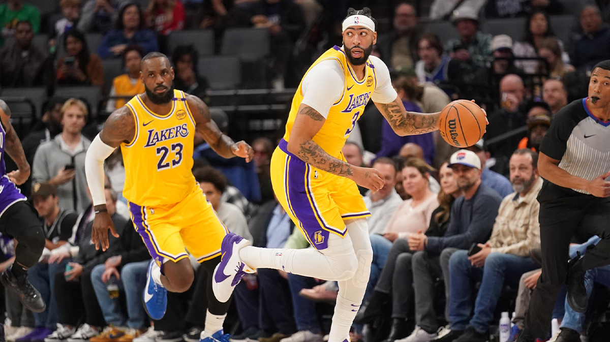 Los Angeles Lakers forward Anthony Davis (3) dribbles the ball next to forward LeBron James (23) against the Sacramento Kings in the first quarter at the Golden 1 Center.