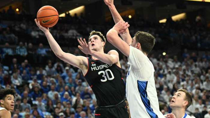 Connecticut Huskies forward Liam McNeeley (30) drives against Creighton Bluejays center Ryan Kalkbrenner (11) during the first half at CHI Health Center Omaha.