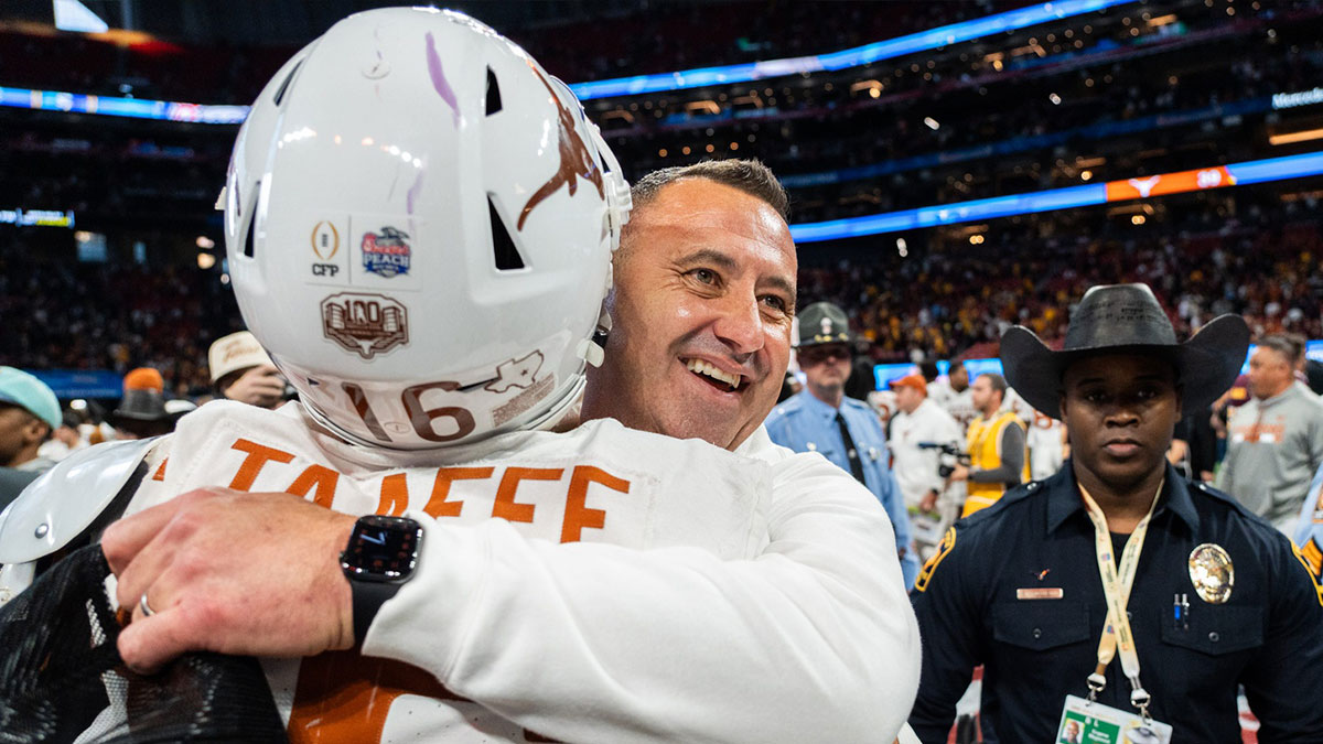 Texas Longhorns head coach Steve Sarkisian embraces Texas Longhorns defensive back Michael Taaffe (16) as they celebrate their win in the Peach Bowl College Football Playoff quarterfinal against Arizona State