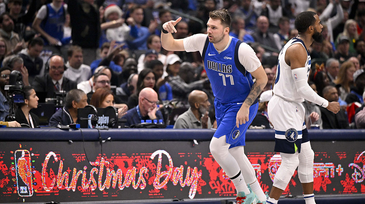 25. December 2024. years; Dallas, Texas, USA; Dallas Mavericks Guard Luka Doncic (77) celebrates after making a basket in three points against Minnesota Timbervolves during the first quarter to the center of American Airlines. Mandatory credit: Jerome Miron-Imagn Pictures