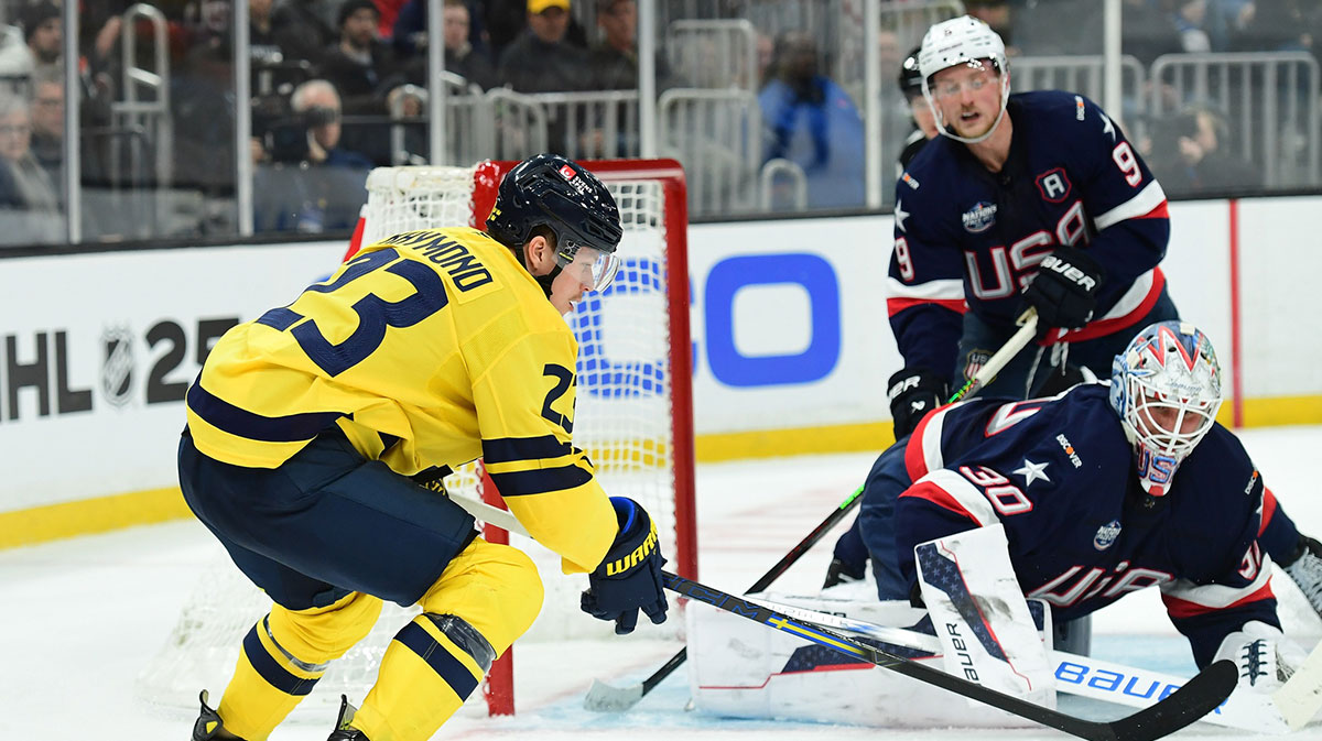 Feb 17, 2025; Boston, MA, USA; [Imagn Images direct customers only] Team Sweden forward Lucas Raymond (23) handles the puck in front of Team USA goalie Jake Ottinger (30) during the second period in a 4 Nations Face-Off ice hockey game at TD Garden.