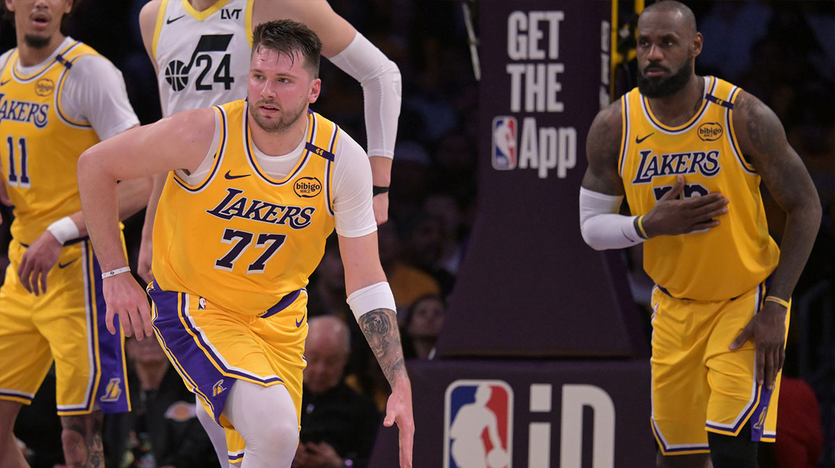 Los Angeles Lakers Guard Lubro Doncic (77) Takes the ball down as far as Lebron James (23), looks vs. Utah Jazz at the Cripto.com Arena.