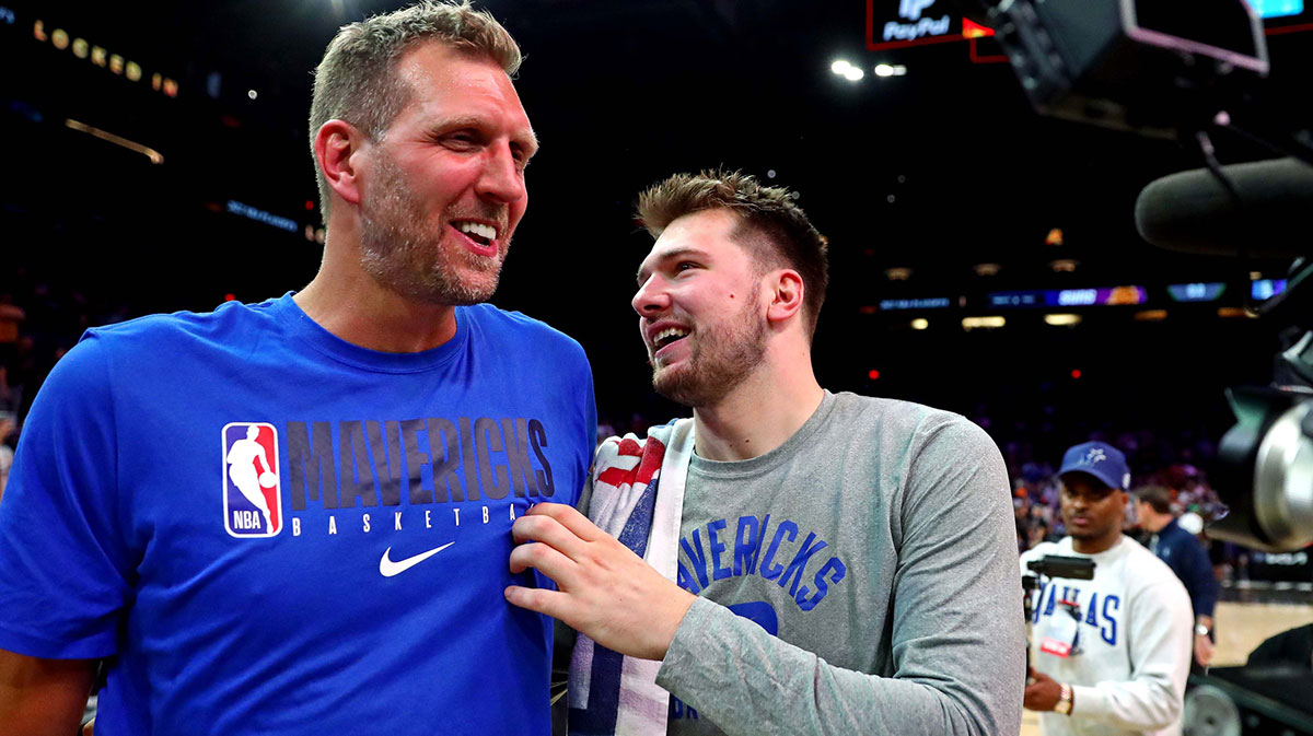 Dallas Mavericks Guard Luka Doncic (77) Welcomes the former player of Dirk Novitzki, after beating Phoenix Suns in the game seven from the second round of the playoffs at 2022. years on Footprint Center. 